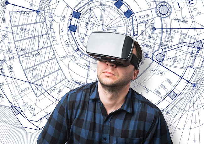 A man wearing a blue and black checkered button-down shirt wears a black augmented reality headset. In the background is a blue and white sketch. 