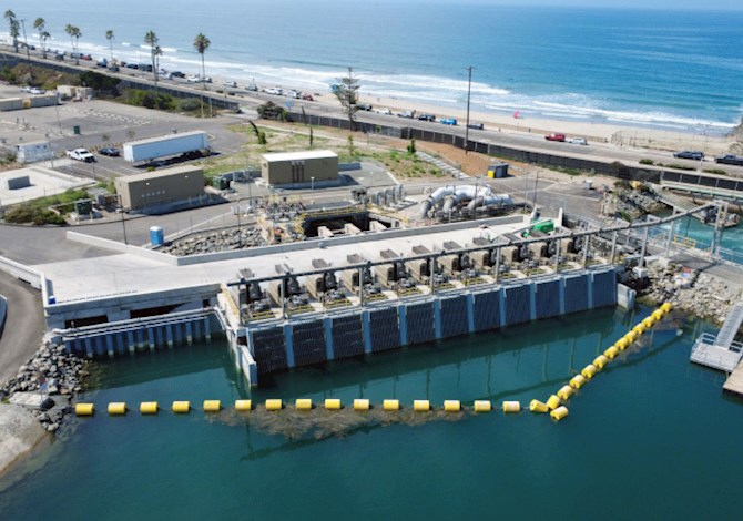Aerial view of the Carlsbad Desalination Plant permanent intake system modifications, showing intake structures along the coastline.