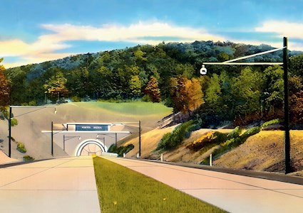 Colorized postcard shows the roadway leading to the entrance of a tunnel. The entrance is at the base of a mountain. There are fall-colored leaves on the trees. 