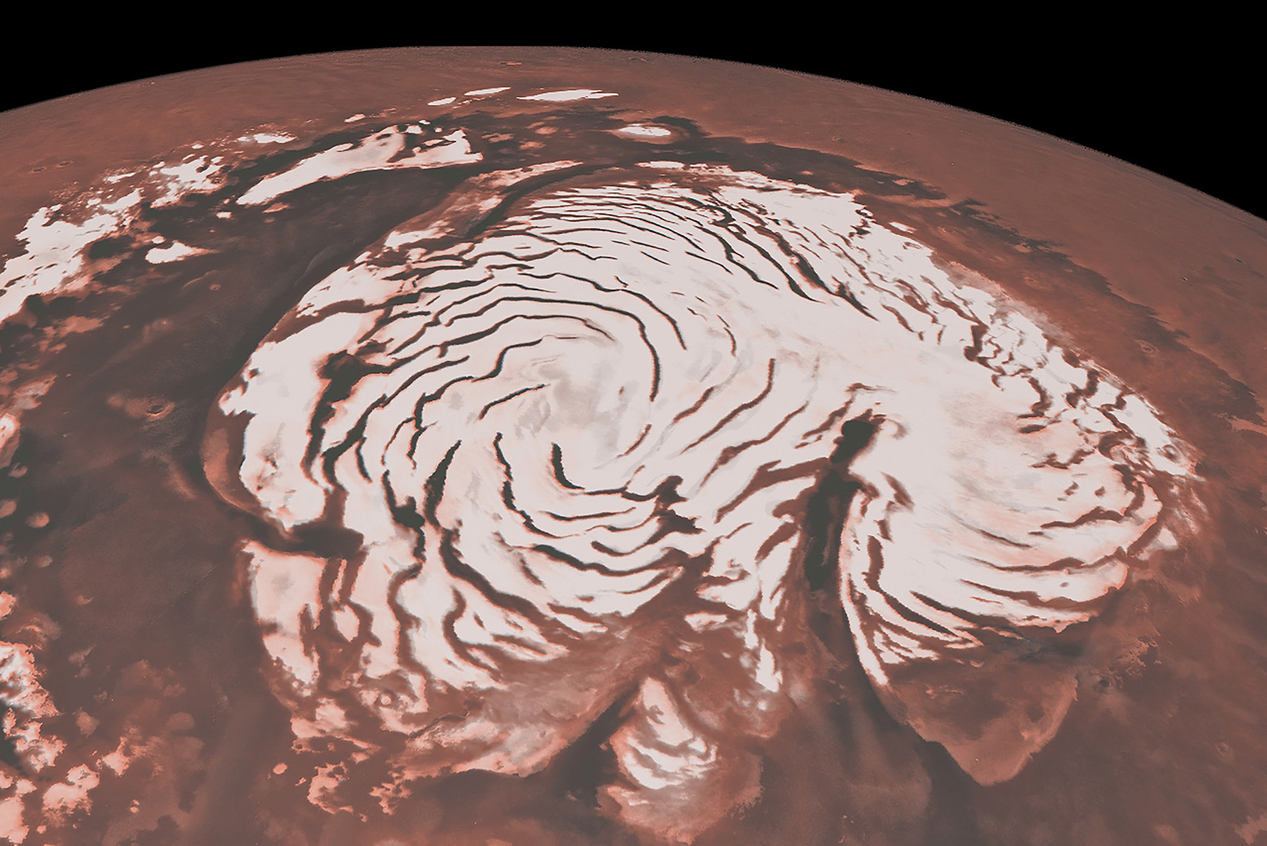 A photograph of a polar region on Mars shows extensive ice covering the surface. 