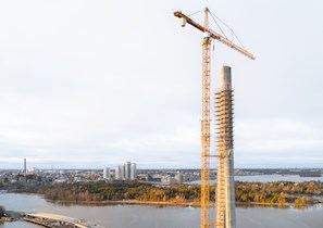 Aerial view of a bridge pylon under construction with crane