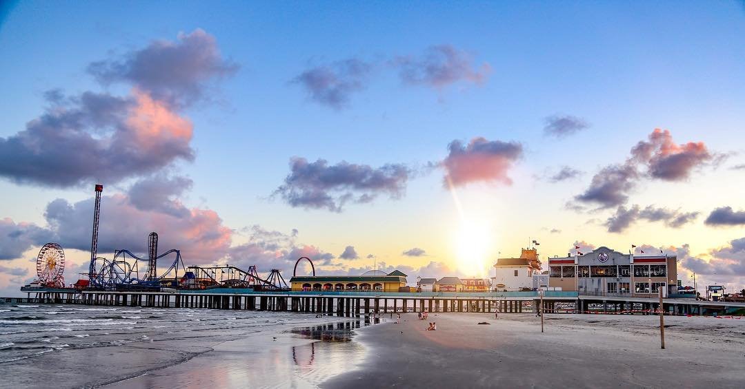 The Capt. Trey offshore tug and supply ship sails past the Orion Highway vehicles carrier and into a sailboat marina in the Port of Galveston ship channel