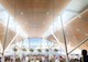 interior view of a terminal featuring greenery and a domed roof