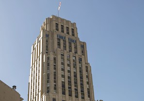 Tall office building seen from below on city street